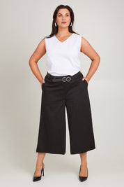 Model Poppy wearing size 16 of the Belle Cotton Sateen Culottes in colour Black (Black), from the front, showing the whole outfit
