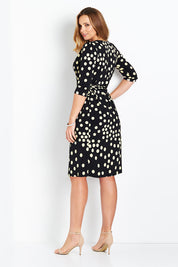 Model Bree wearing size 14 of the Belle Spot Print Wrap Dress in colour Black (Black), from the back