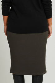 Model Monique wearing size 14 of the Belle Textured Pull On Skirt in colour Pinegreen (Green), from the back