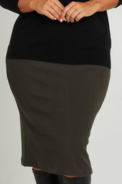 Model Monique wearing size 14 of the Belle Textured Pull On Skirt in colour Pinegreen (Green), from the front, cropped image