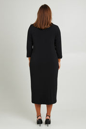 Model Monique wearing size 14 of the Belle 3/4 Sleeve Slip Dress in colour Black (Black), from the back