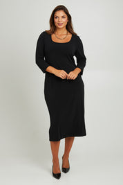 Model Monique wearing size 14 of the Belle 3/4 Sleeve Slip Dress in colour Black (Black), from the front, showing the whole outfit