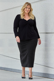 Model Caitlin wearing size 18 of the Belle Pull On Rib Maxi Skirt in colour Mocha, from the front, showing the whole outfit