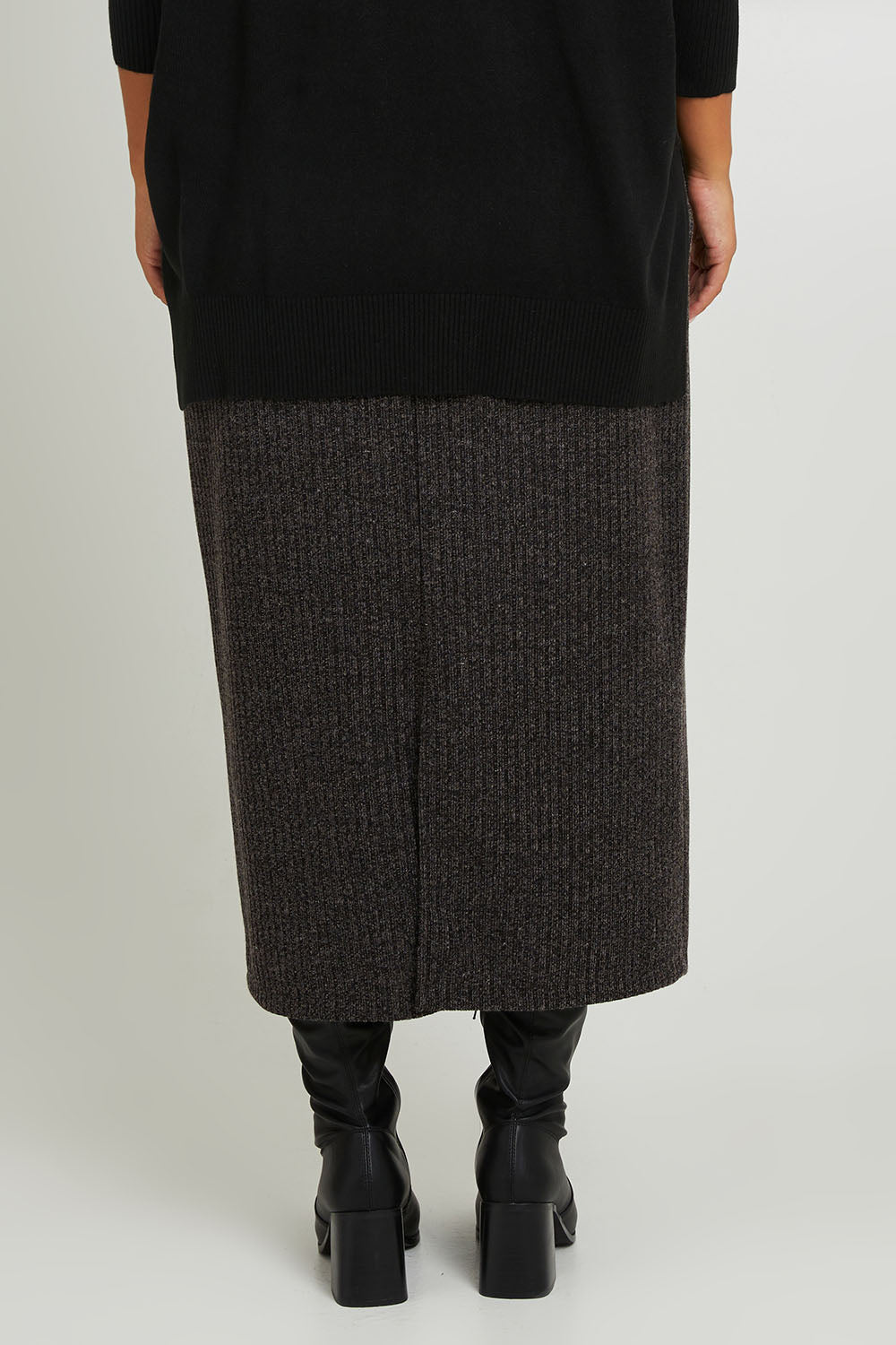 Model Monique wearing size 14 of the Belle Pull On Rib Maxi Skirt in colour Mocha, from the back