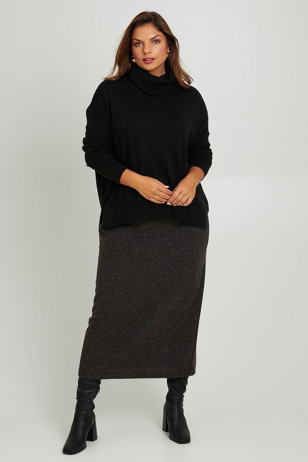 Model Monique wearing size 14 of the Belle Pull On Rib Maxi Skirt in colour Mocha, from the front, showing the whole outfit