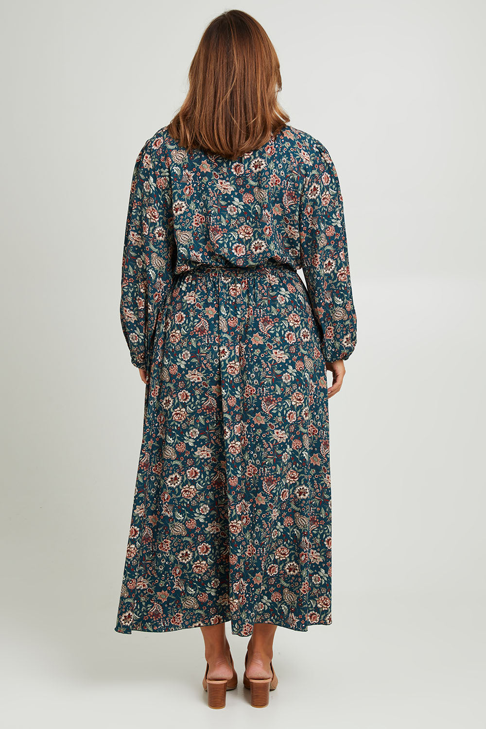 Model Monique wearing size 14 of the Belle X Over Maxi Dress in colour Fluergreen (Green), from the back