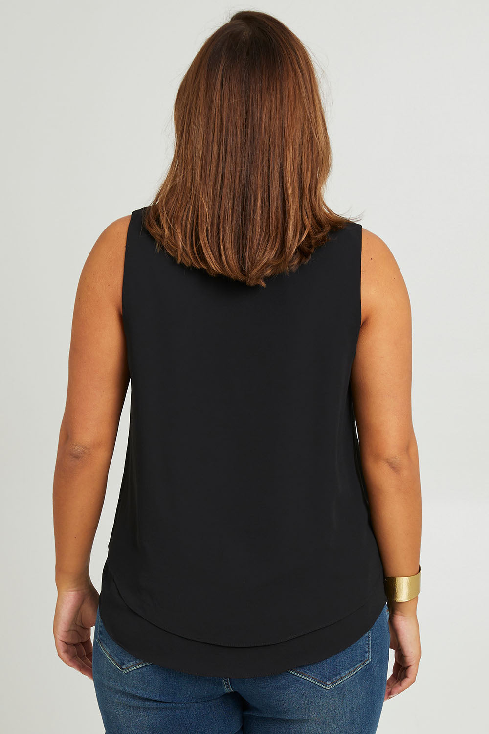 Model Monique wearing size 14 of the Belle Double Layer Woven Tank in colour Black (Black), from the back