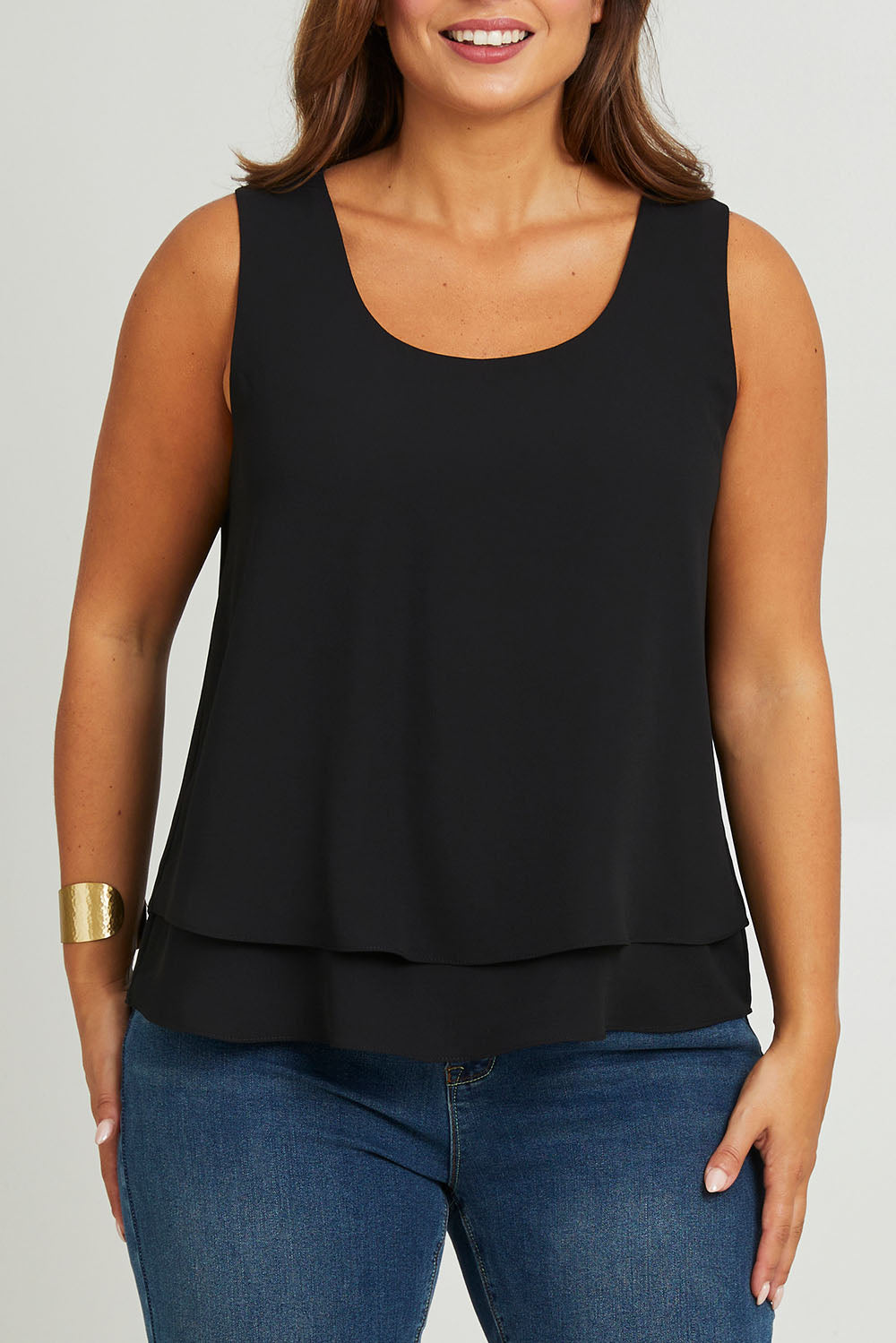 Model Monique wearing size 14 of the Belle Double Layer Woven Tank in colour Black (Black), from the front, cropped image