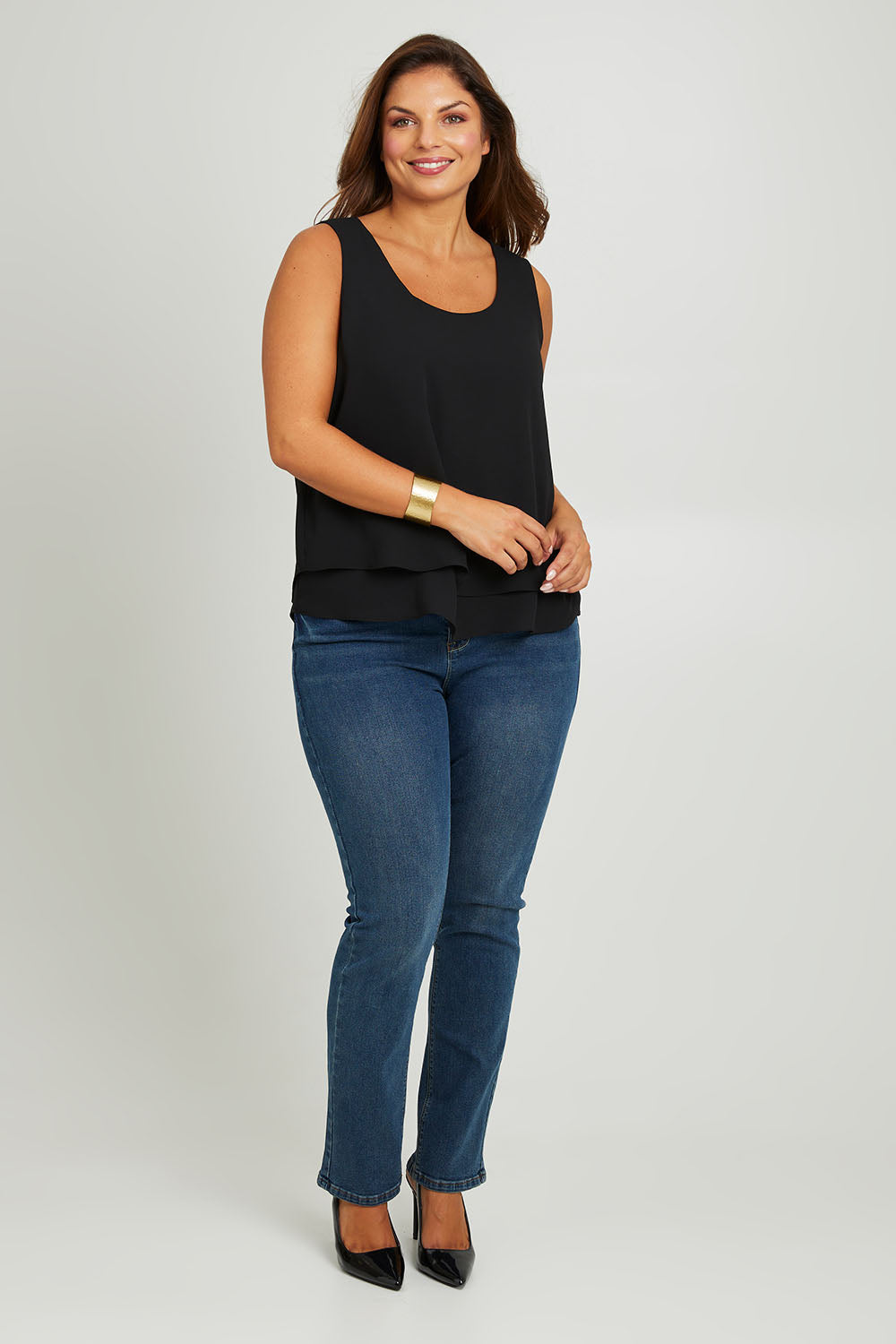 Model Monique wearing size 14 of the Belle Double Layer Woven Tank in colour Black (Black), from the front, showing the whole outfit