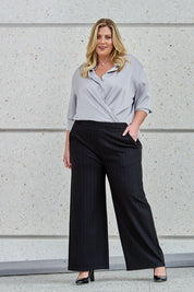 Model Caitlin wearing size 18 of the Belle Wide Leg Printed Ponte Pant in colour Blackstrip (Black), from the front, showing the whole outfit