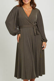 Model Monique wearing size 14 of the Belle Full Skirt Dress in colour Khaki (Green), from the front, cropped image