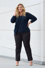 Model Caitlin wearing size 18 of the Belle Printed Ponte Pull On Pant in colour Ochrenavy (Blue), from the front, showing the whole outfit