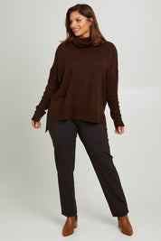 Model Monique wearing size 14 of the Belle Printed Ponte Pull On Pant in colour Ochrenavy (Blue), from the front, showing the whole outfit
