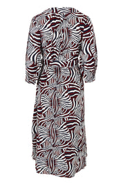 Product shot of the Belle Puff Sleeve Wrap Dress in colour Inkwine (Blue), from the back