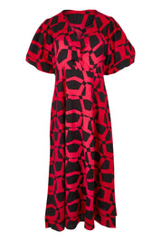 Product shot of the Belle Printed Twist Knot Detail Cotton Dress in colour Blackrasp (Black), from the front