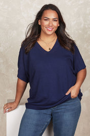 Model Ashleigh wearing size XL of the Belle Cool Knit Relaxed Tee in colour Inknavy (Blue), from the front, showing the whole outfit