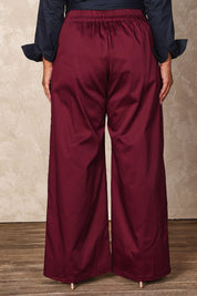Model Ashleigh wearing size 16 of the Belle Cotton Comfort Wide Leg Pant in colour Burgundy (Purple), from the back