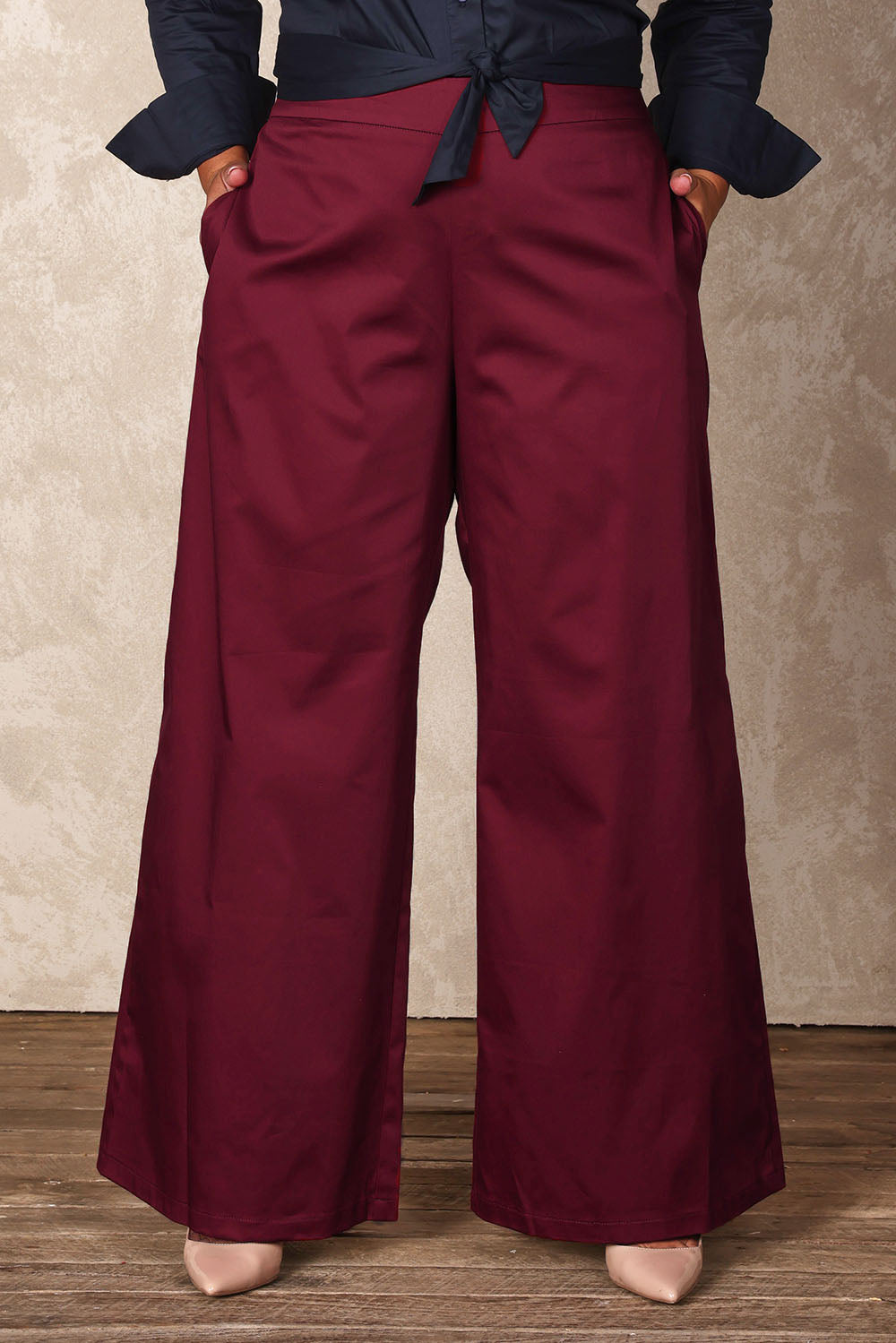 Model Ashleigh wearing size 16 of the Belle Cotton Comfort Wide Leg Pant in colour Burgundy (Purple), from the front, cropped image
