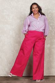 Model Ashleigh wearing size 16 of the Belle Cotton Comfort Wide Leg Pant in colour Hotpink (Pink), from the front, showing the whole outfit