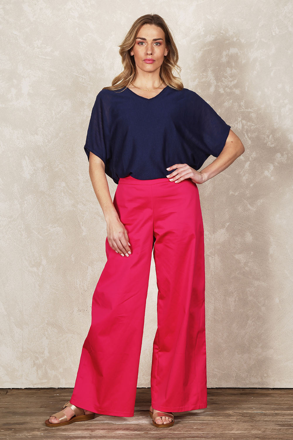 Model Olivia wearing size 10 of the Belle Cotton Comfort Wide Leg Pant in colour Hotpink (Pink), from the front, showing the whole outfit
