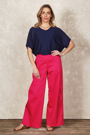 Model Olivia wearing size 10 of the Belle Cotton Comfort Wide Leg Pant in colour Hotpink (Pink), from the front, showing the whole outfit