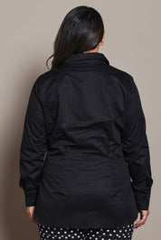 Model Ashleigh wearing size 16 of the Belle Tie Waist Cotton Shirt in colour Black (Black), from the back
