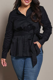 Model Ashleigh wearing size 16 of the Belle Tie Waist Cotton Shirt in colour Black (Black), from the front, cropped image