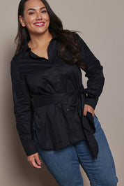 Model Ashleigh wearing size 16 of the Belle Tie Waist Cotton Shirt in colour Black (Black), from the front, cropped image