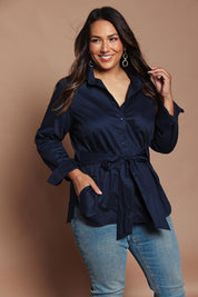 Model Ashleigh wearing size 16 of the Belle Tie Waist Cotton Shirt in colour Navy (Blue), from the front, showing the whole outfit