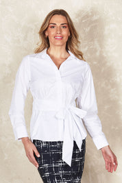 Model Olivia wearing size 10 of the Belle Tie Waist Cotton Shirt in colour White (White), from the front, showing the whole outfit