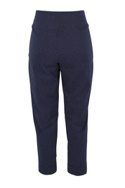 Product shot of the Belle Printed Slim Pant in colour Navyspot (Blue), from the back