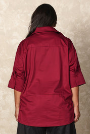 Model Ashleigh wearing size 16 of the Belle Easy Cotton Pop Over Top in colour Chillired (Red), from the back