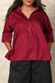 Model Ashleigh wearing size 16 of the Belle Easy Cotton Pop Over Top in colour Chillired (Red), from the front, cropped image
