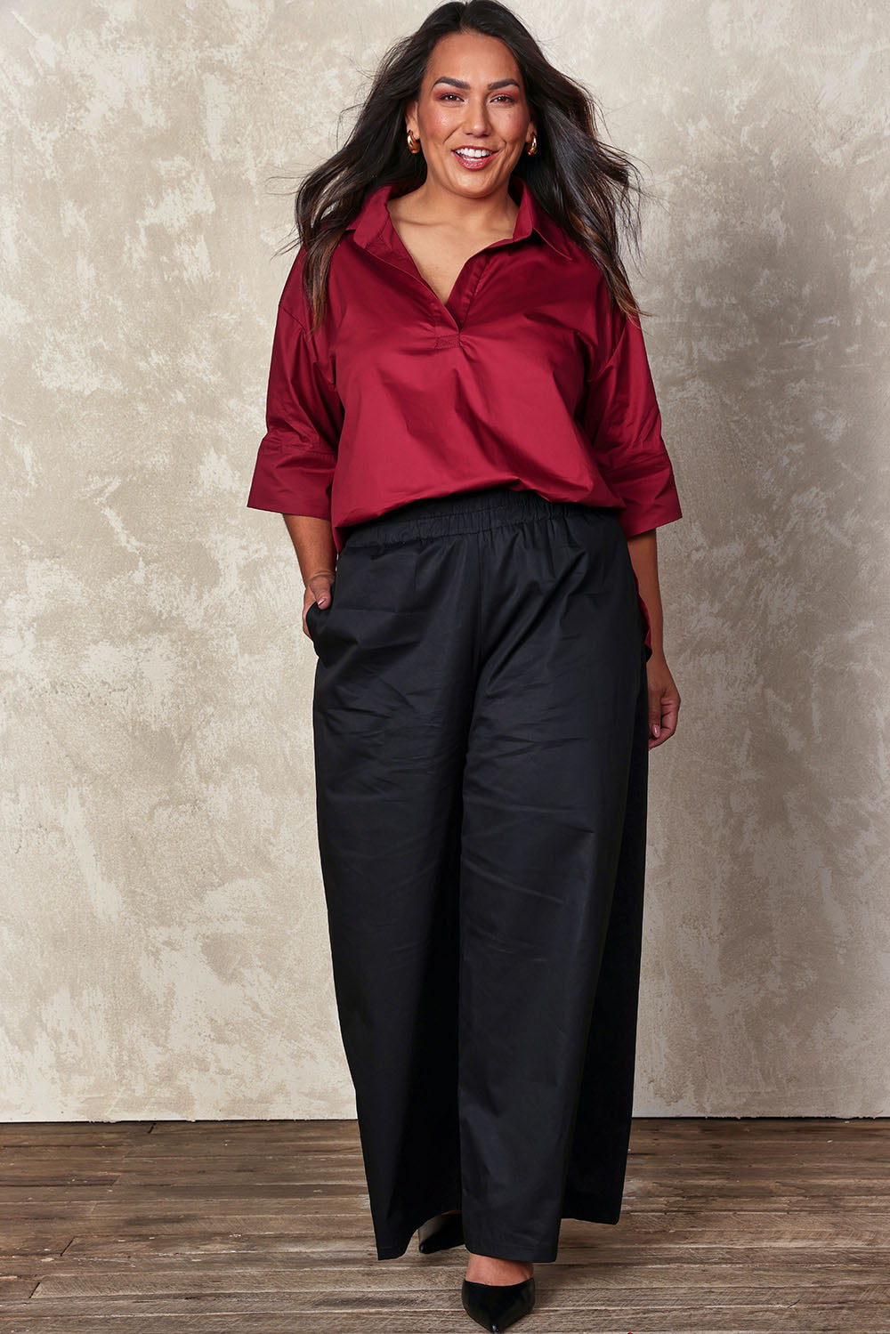 Model Ashleigh wearing size 16 of the Belle Easy Cotton Pop Over Top in colour Chillired (Red), from the front, showing the whole outfit