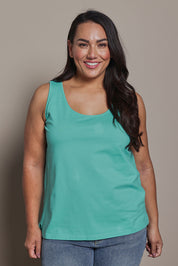Model Ashleigh wearing size 16 of the Belle Luxe Cotton Tank in colour Aqua (Blue), from the front, cropped image