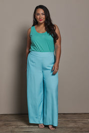Model Ashleigh wearing size 16 of the Belle Luxe Cotton Tank in colour Aqua (Blue), from the front, showing the whole outfit