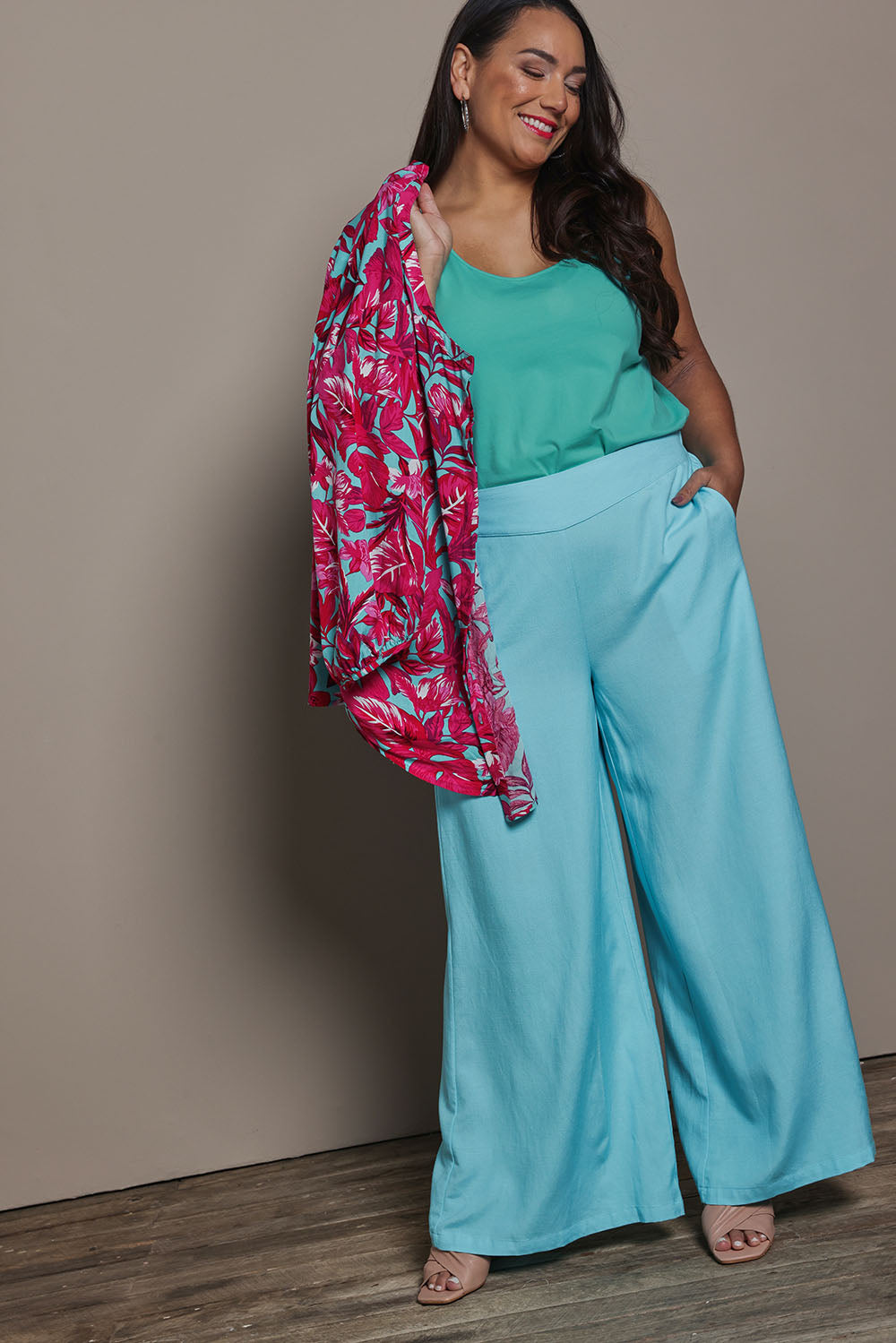 Model Ashleigh wearing size 16 of the Belle Luxe Cotton Tank in colour Aqua (Blue), from the front, showing the whole outfit