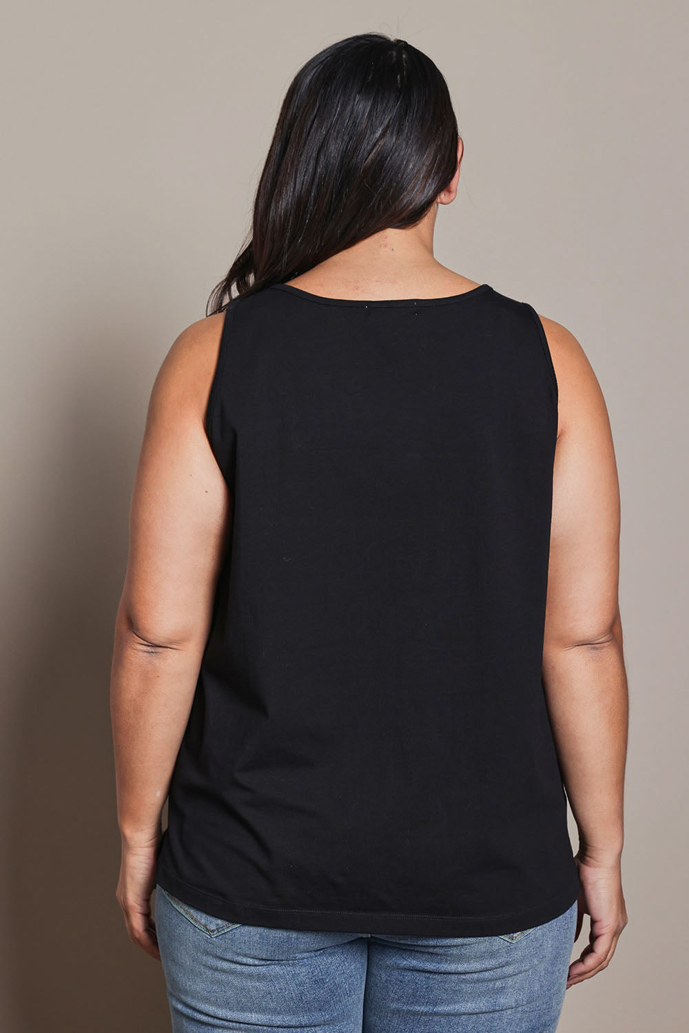 Model Ashleigh wearing size 16 of the Belle Luxe Cotton Tank in colour Black (Black), from the back
