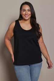 Model Ashleigh wearing size 16 of the Belle Luxe Cotton Tank in colour Black (Black), from the front, cropped image