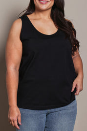 Model Ashleigh wearing size 16 of the Belle Luxe Cotton Tank in colour Black (Black), from the front, cropped image