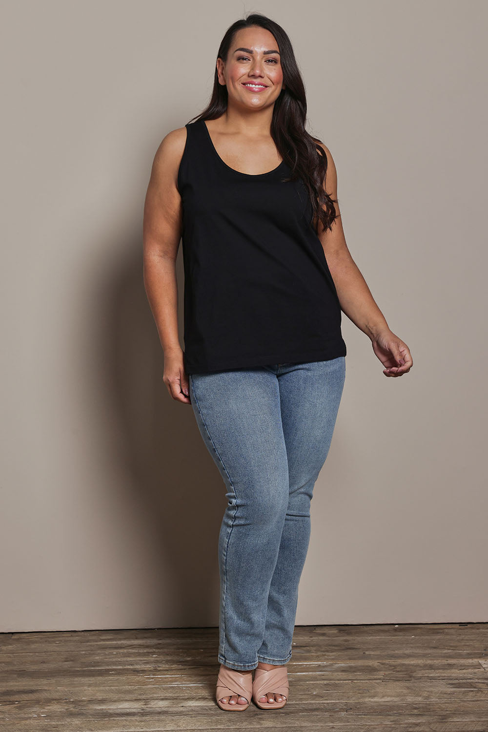 Model Ashleigh wearing size 16 of the Belle Luxe Cotton Tank in colour Black (Black), from the front, showing the whole outfit
