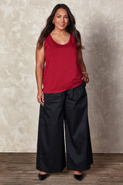 Model Ashleigh wearing size 16 of the Belle Luxe Cotton Tank in colour Chilli (Red), from the front, showing the whole outfit