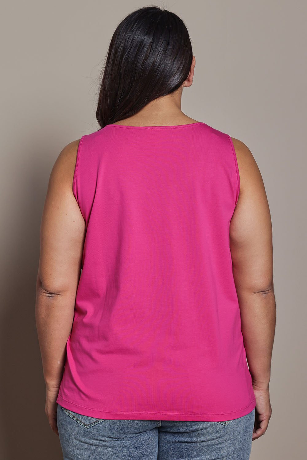 Model Ashleigh wearing size 16 of the Belle Luxe Cotton Tank in colour Fuschia (Pink), from the back