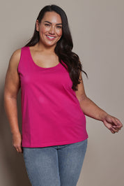 Model Ashleigh wearing size 16 of the Belle Luxe Cotton Tank in colour Fuschia (Pink), from the front, cropped image