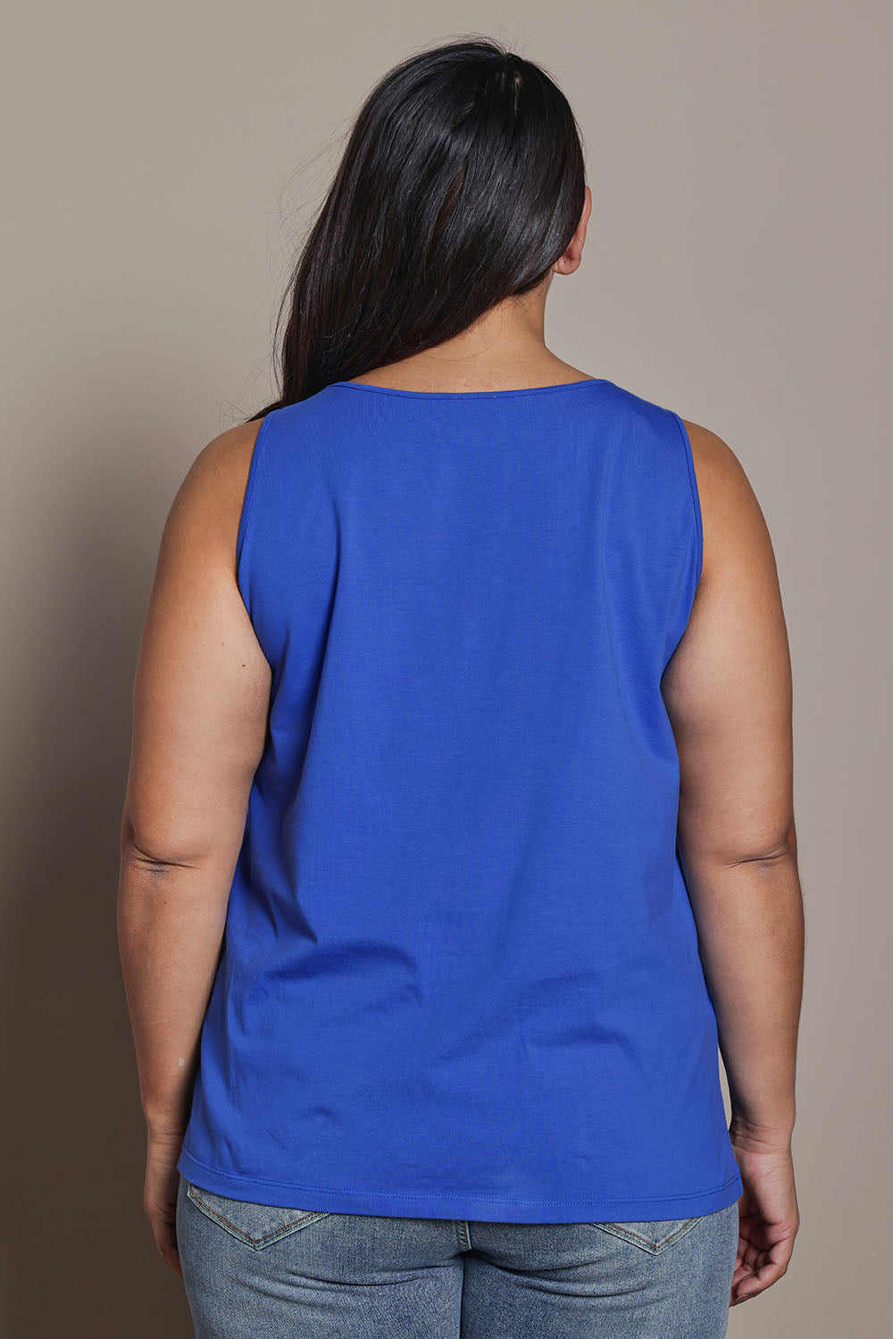 Model Ashleigh wearing size 16 of the Belle Luxe Cotton Tank in colour Seablue (Blue), from the back