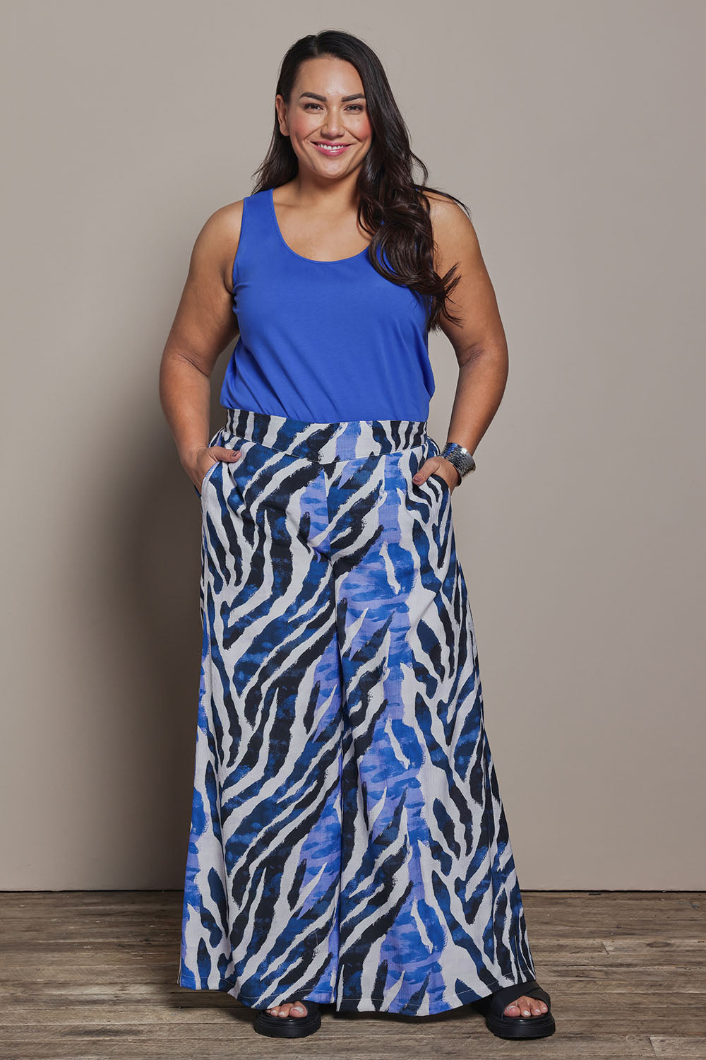 Model Ashleigh wearing size 16 of the Belle Luxe Cotton Tank in colour Seablue (Blue), from the front, showing the whole outfit