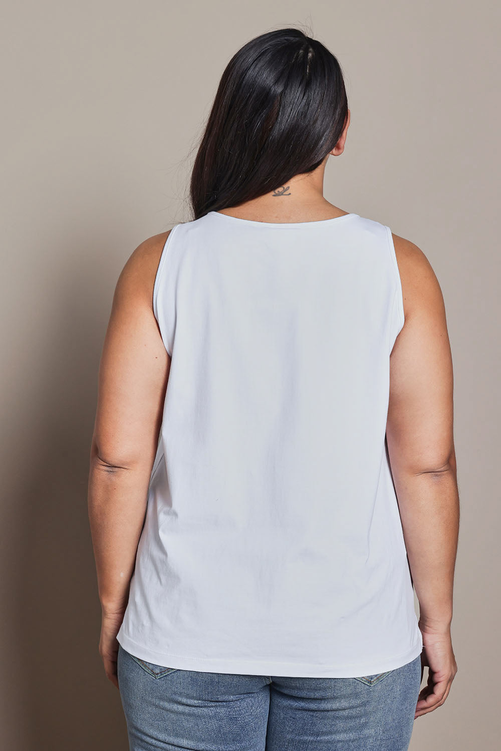 Model Ashleigh wearing size 16 of the Belle Luxe Cotton Tank in colour White (White), from the back