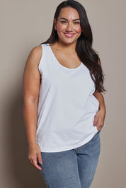 Model Ashleigh wearing size 16 of the Belle Luxe Cotton Tank in colour White (White), from the front, cropped image
