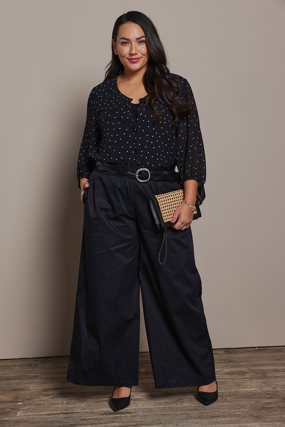 Model Ashleigh wearing size 16 of the Belle Cotton Palazzo Pant in colour Black (Black), from the front, showing the whole outfit