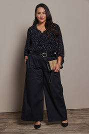 Model Ashleigh wearing size 16 of the Belle Cotton Palazzo Pant in colour Black (Black), from the front, showing the whole outfit
